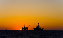  Oil rig silhouetted in the Gulf of Mexico