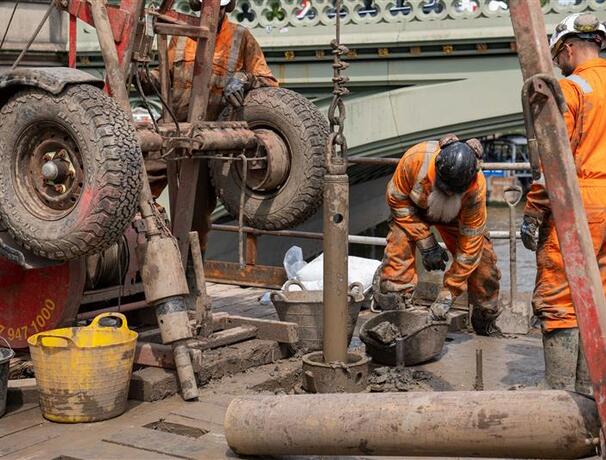 Engineers from Structural Soils conducted overwater drilling beside the Palace of Westminster using a jack-up barge on the River Thames