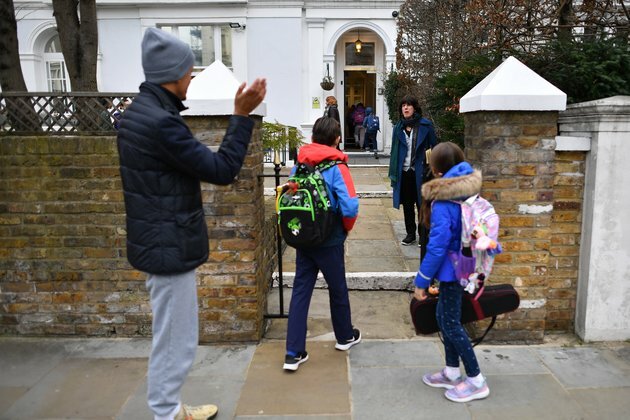 Britain Opens Schools; Vietnam Begins Vaccination Campaign