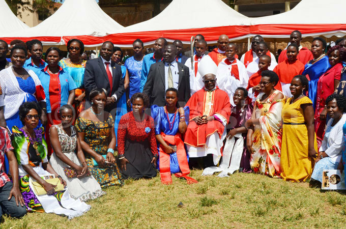 ishop aharagate in a group photo with the schools members of staff after mass
