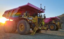 Two of the autonomous haul trucks at Newmont's Boddington gold mine.