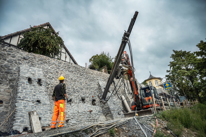 Injection boreholes and masonry nails were installed along with structural reinforcement using self-drilling anchors