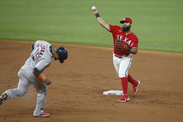 Astros fall to Rangers in 10 but still clinch postseason bid