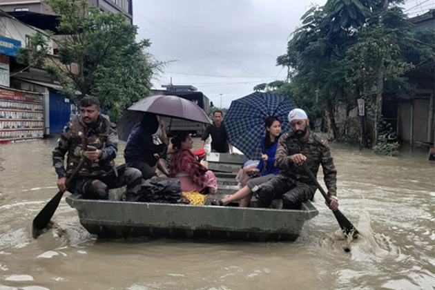 Security personnel rescue people stranded in floods in Northeastern states