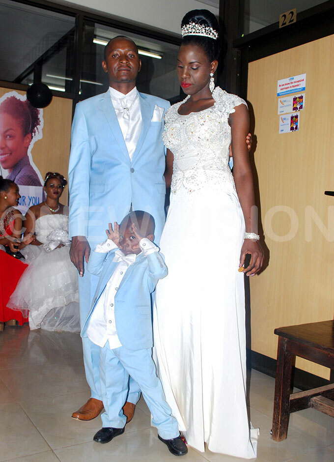  oseph and arol anyike posing for a photo shortly after their civil wedding at ganda egistrations ervices ureau ampala 