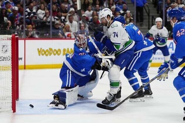 NHL-worst Canucks stun league-best Avalanche 8-6