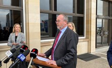  Mines minister Bill Johnston speaking to the media at Parliament House yesterday