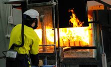 A fire assay being conducted at the Intertek Minerals Global Centre of Excellence.