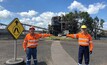  BHP CEO Mike Henry (right) was all smiles as he practised social distancing at the Peak Downs coal mine in Queensland, Australia