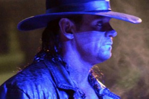 Undertaker returns to the ring to partner Roman Reigns