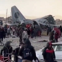Military cargo plane loaded with cash crashes on highway 