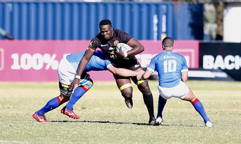 Cliven loubser and janco venter of namibia attaempt to stop uganda s aurthur mukama in windhoek 350x210
