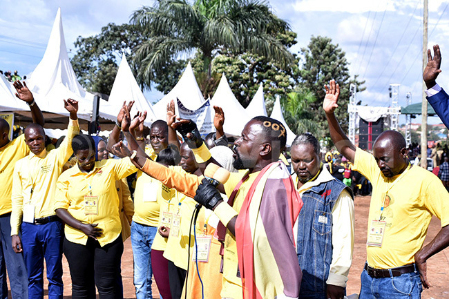  subuga leading the congregation in prayer for resident useveni