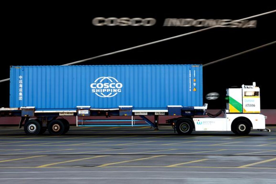 Silent convoy of Chinese driverless trucks expands presence at Britain's busiest port