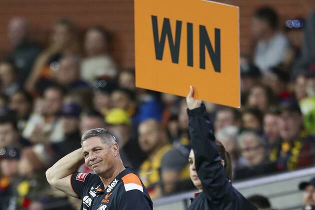 GWS Giants vs Adelaide Crows- Footy fans lose their minds over AFL team's bizarre one-word sign