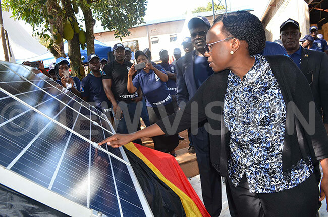  r ceng examining one of the solar panels which are going to be distributed to government health facilities 