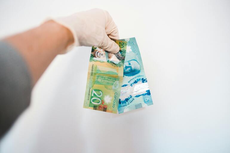 Loonie slides as traders await next week's rate decision