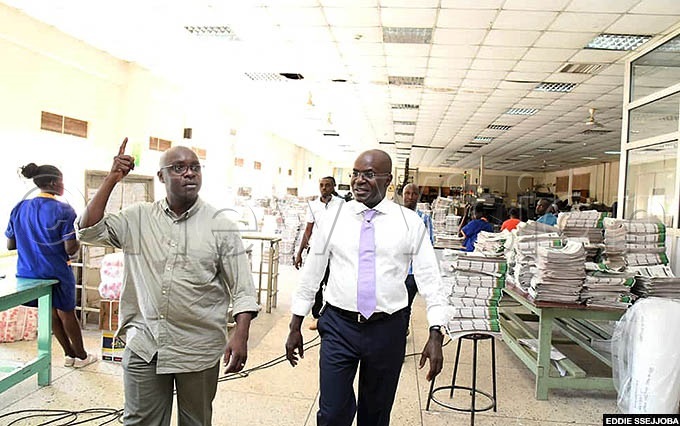  he education ministry permanent secretary lex akooza was showed around the printing press facility at ision roup offices in ampala by abushenga