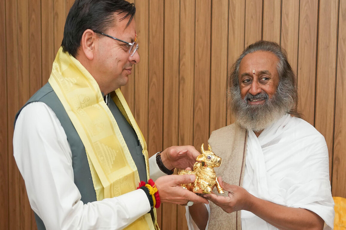 Uttarakhand CM meets spiritual leader Sri Sri Ravi Shankar in Rishikesh