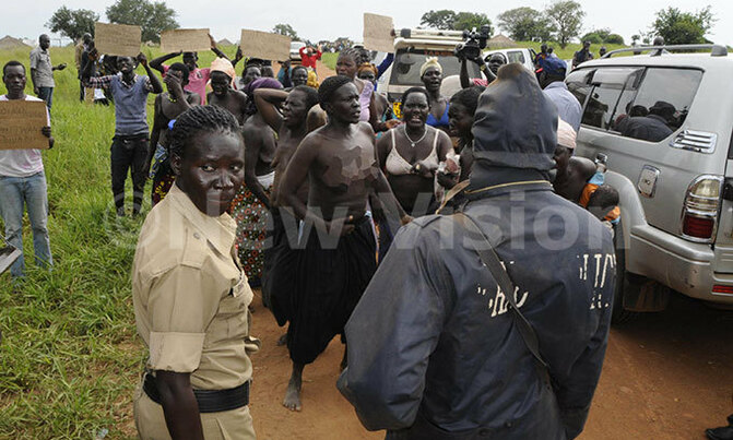 Amuru women strip to block land survey Amuru women strip to block land survey