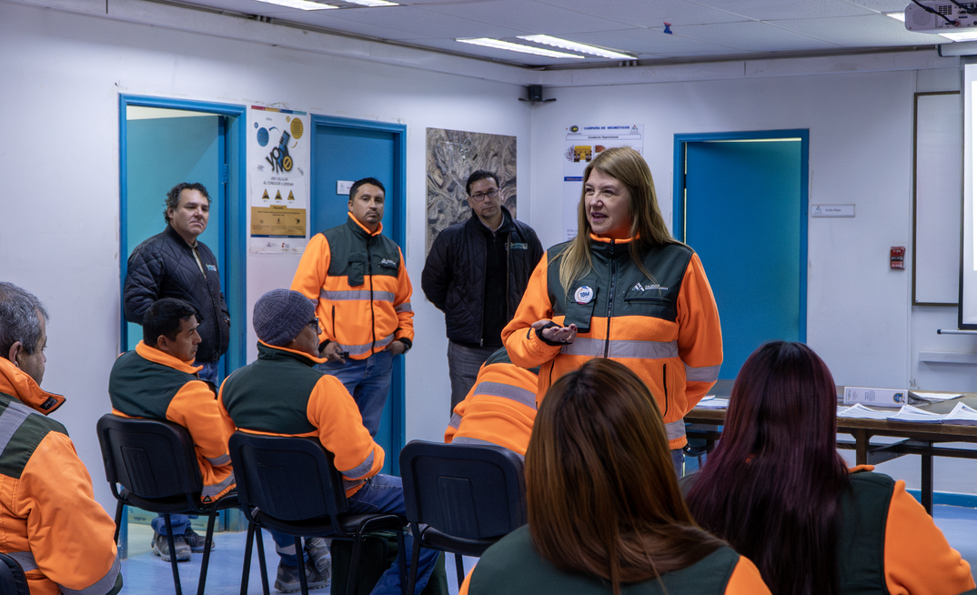 Maria de la Luz Osses speaks with her team