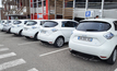  A row of Renault Zoe cars charging at a supermarket
