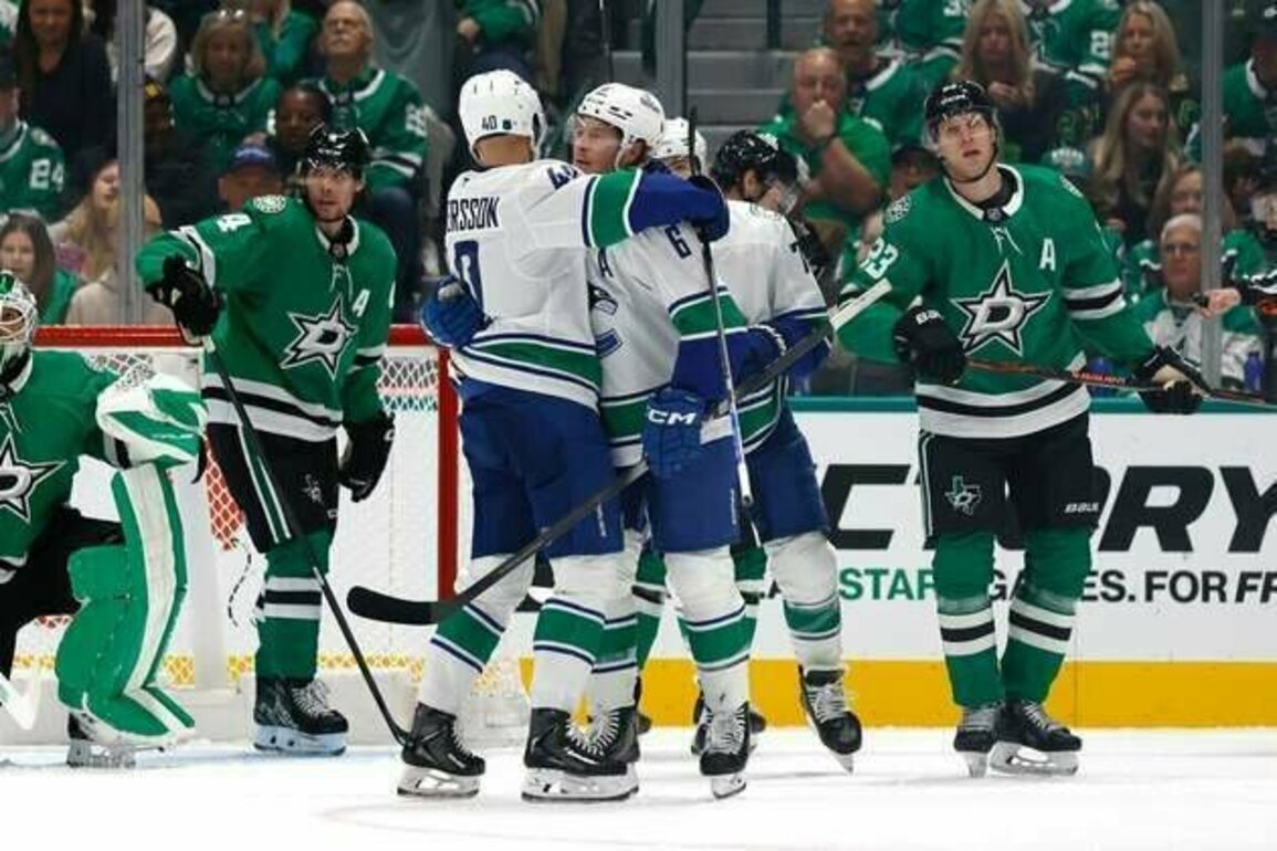 Four-goal second period propels Canucks past Stars