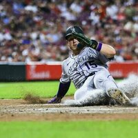 Rockies edge Reds in series opener thanks to wild pitch