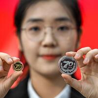 China's central bank issues commemorative coins for Xinjiang Uygur Autonomous Region 70th anniversary