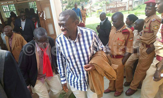 Besigye charged, out on bail Besigye charged, out on bail