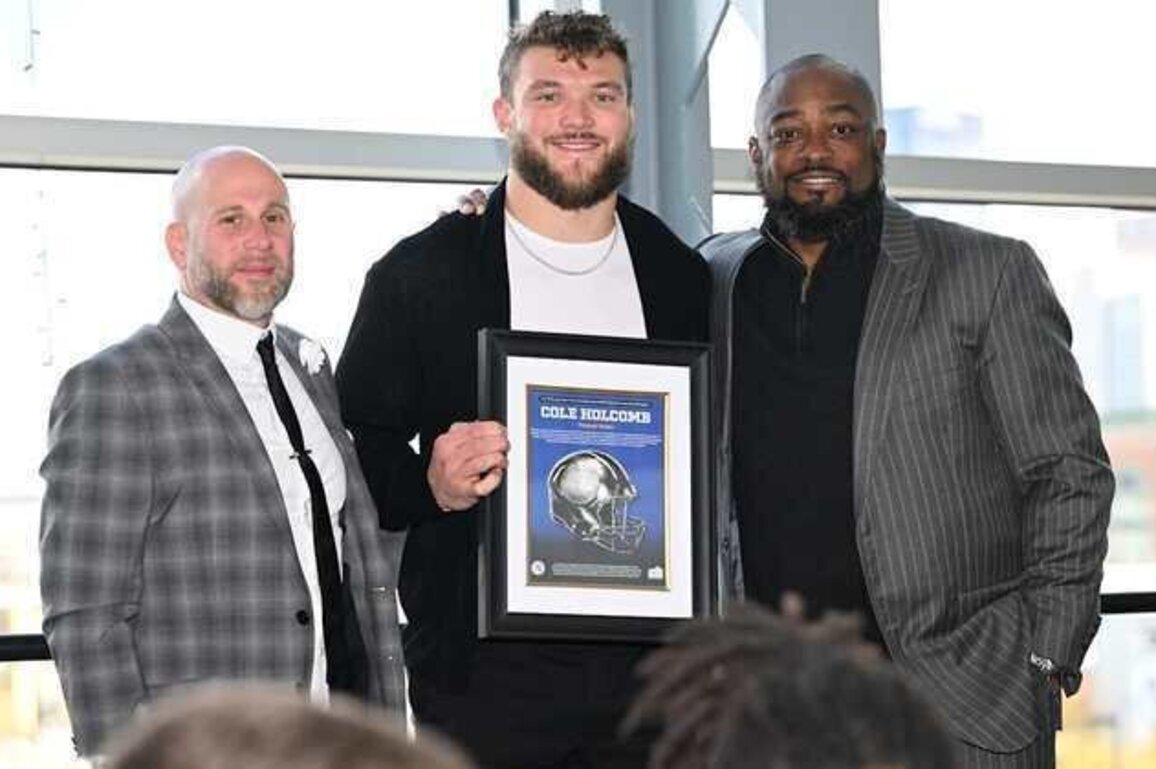 Holcomb honored for his strength through trying times