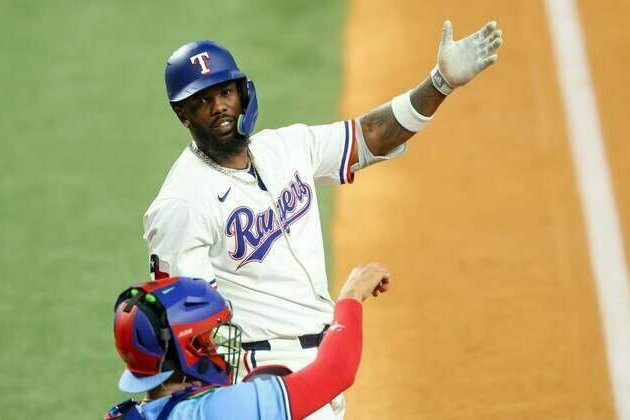 Benched Rangers OF Adolis Garcia working on mechanics