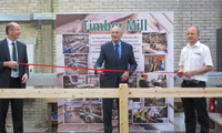 Covers launches renewed timber mill 