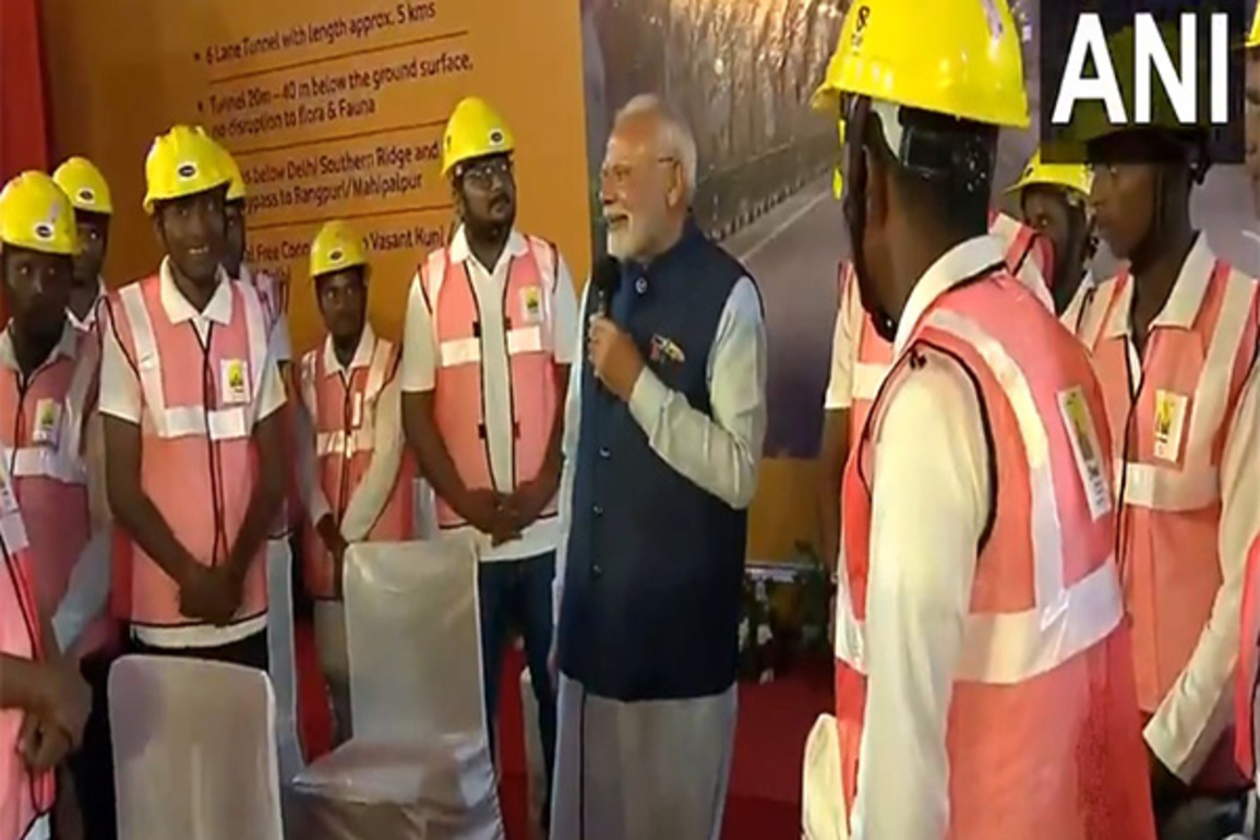 PM Modi interacts with construction workers before inauguration of two national highway project in Delhi