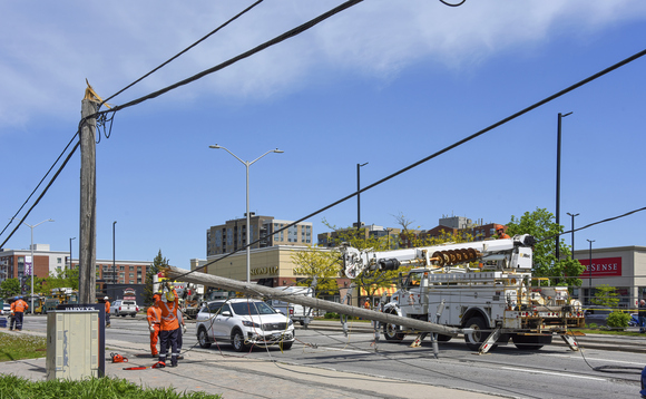 Hydro workers repairing downed power pole snapped during severe storm in Ottawa, Canada, in May 2022 | Credit: iStock