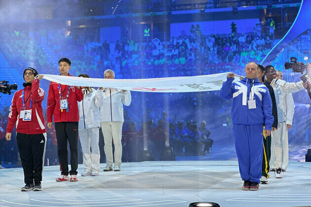 Special Olympics UAE athlete Mina Al Mazrouei raises Special Olympics flag at Opening Ceremony of Turin 2025 Games