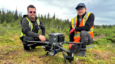 Altomaxx technicians prepare a DJI M350 RTK drone and gamma-ray spectrometer for a survey 