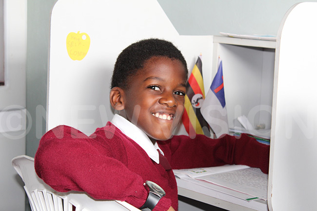   child sits in his office in class