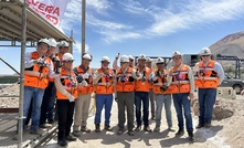 The executives toured the site with division workers