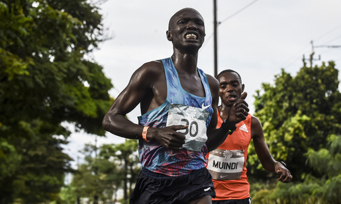 Kenyan runner hit by car during marathon Kenyan runner hit by car during marathon