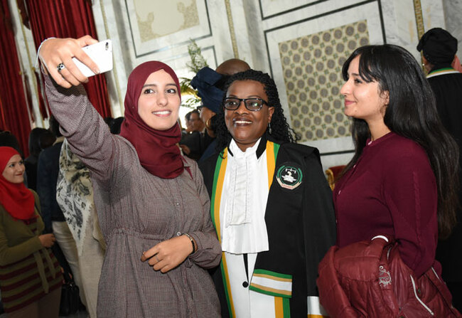   niversity students pose for a picture with ady ustice arie hrse ukamulisa of wanda m after the opening ceremony of the 51st rdinary ession of the frican ourt in unisunisia on 12 ovember 2018 courtesy ictures