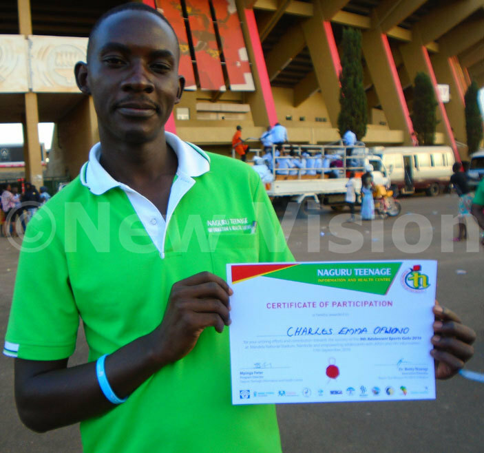 harles fwono displays his certificate 