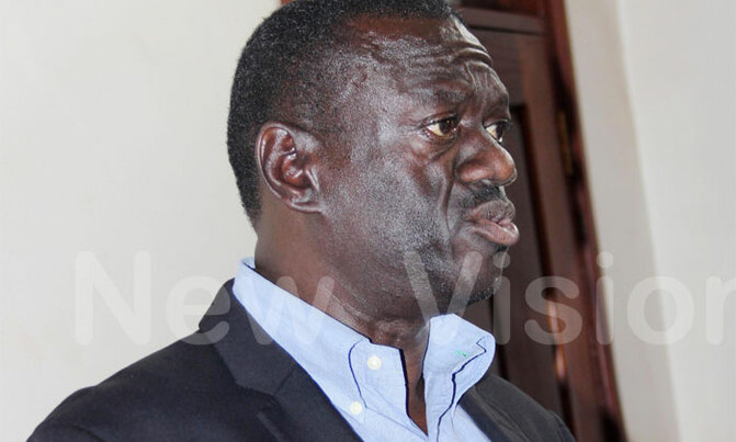 We are wasting time, says Besigye at court We are wasting time, says Besigye at court