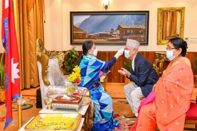Nepal President offers Tika to Nepal PM on Dashami