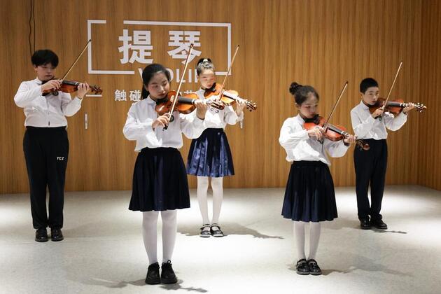 Where guns once roared, violins strike new chord in rural China