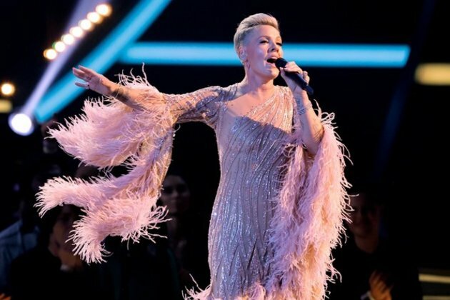 Pink honours late 'Grease' star with heartfelt performance at AMAs