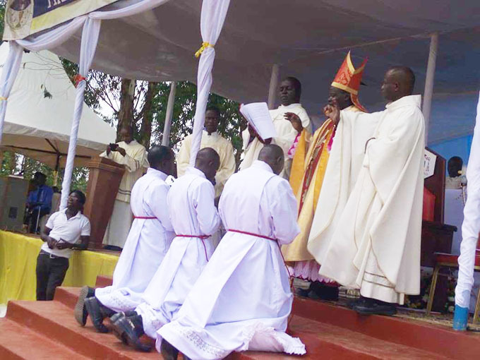  ishop ibuuka ordaining some of the priests