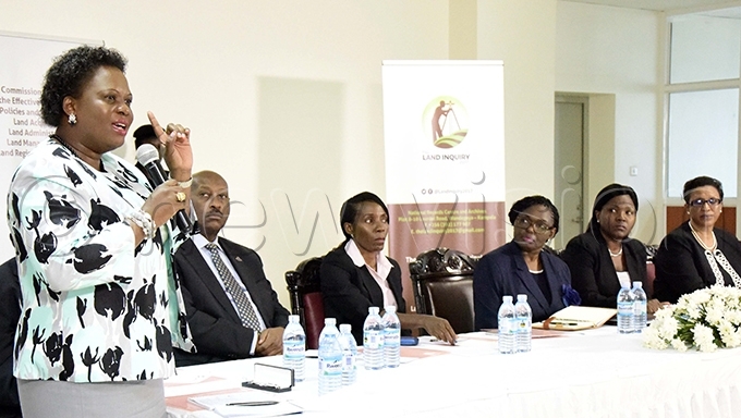 inister for lands etty mongi addresses the land inquiry commission chaired by ustice atherine amugemereirwe 3rd right during the launch of the commission in ay 2017 ile hoto