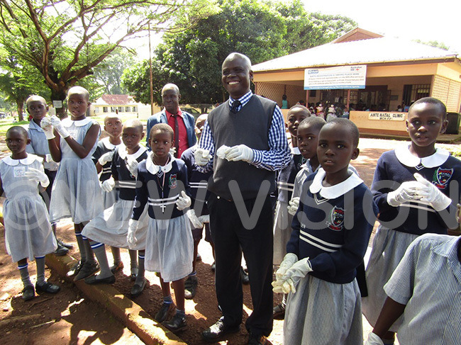  bura and pupils pose for a picture after cleaning the hospital 