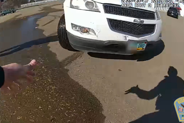BWC- Woman strikes N.D. officer with car, throwing him into a fence before fatal OIS